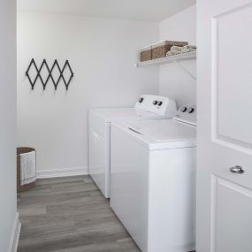 Laundry room with full-size washer and dryer in apartment home at Camden Brickell apartments in Miami, FL