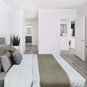 Bedrooms with vinyl flooring and ensuite bath at Camden Brickell apartments in Miami, FL