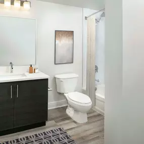 Bathroom with garden tub and linen pantry at Camden Brickell Apartments in Miami, FL.