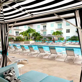 Poolside cabanas at Camden Brickell apartments in Miami, FL