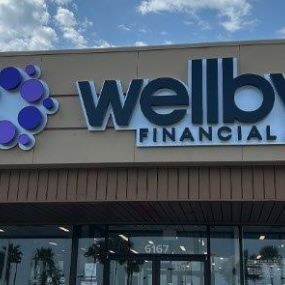 Exterior signage of Wellby Financial in Galveston