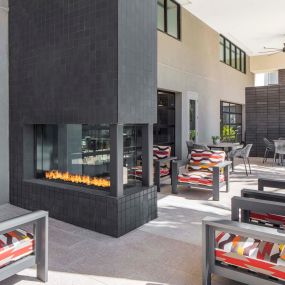 Camden Tempe West Apartments in Tempe Arizona outdoor resident lounge with fire pit and ample seating options