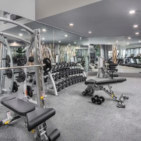 Camden Tempe West Apartments in Tempe Arizona 24-hour fitness center with strength training machines and dumbbell free weights