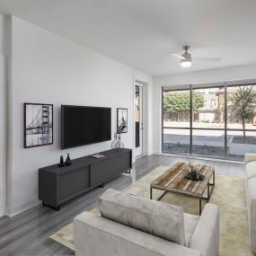 Camden Tempe West Apartments in Arizona Living Room with floor to ceiling windows and lighted ceiling fan in Live/Work Apartment Home