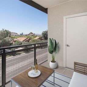 Camden Tempe West Apartments Tempe Arizona patio with space for a couch and a coffee table and a view of Papago Park