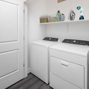 Camden Tempe West Apartments Tempe Arizona contemporary side by side full-size washer and dryer with wooden shelf in the laundry area
