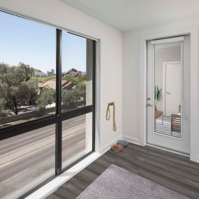Camden Tempe West Apartments Tempe Arizona contemporary living area with floor-to-ceiling window near patio