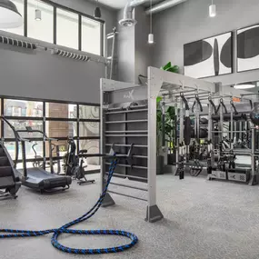 Camden Tempe West Apartments in Tempe Arizona 24-hour fitness center with rope trainer, stair master, and Gym Rax machine