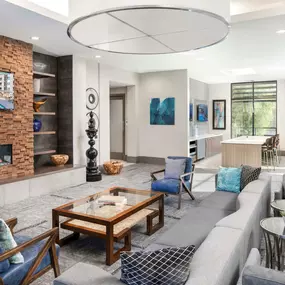 Camden Tempe Apartments Tempe Arizona Resident Lounge with Seating Area, Fireplace, and Catering Kitchen with TV