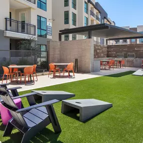 Camden Tempe West Apartments in Tempe Arizona outdoor barbecue grilling area near the pool and corn hole