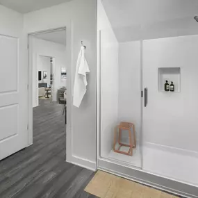 Camden Tempe apartments Tempe Arizona Live Work bathroom with glass-enclosed shower and shower niche