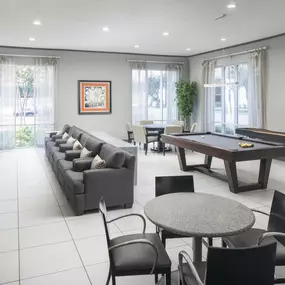 Game room with billiards and shuffleboard at Camden Travis Street Apartments in Midtown Houston, Tx