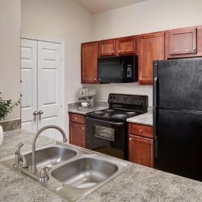 Kitchen with light countertops at Camden Shadow Brook