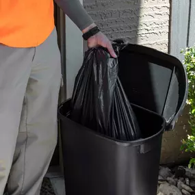 Front door trash pickup at Camden apartments