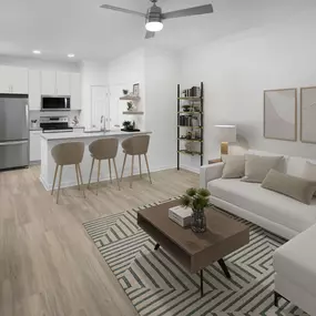 Open-concept living room and kitchen with wood-style flooring at Camden Shadow Brook apartments in Austin, TX