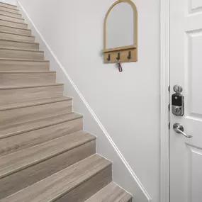 First-floor front door private staircase entry to top-floor home at Camden Shadow Brook apartments in Austin, TX