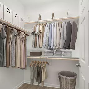 Renovated closet with wood-style floors and wood shelves at Camden Shadow Brook apartments in Austin, TX