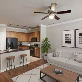 First floor living room and kitchen with island at Camden Shadow Brook in Austin, TX