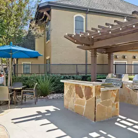 Poolside grills at second pool Camden Shadow Brook apartments in Austin, TX