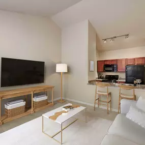 Second floor living room and kitchen with vaulted ceilings at Camden Shadow Brook in Austin, TX