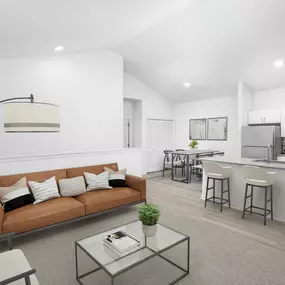 Top floor living room with carpet and private stair entry at Camden Shadow Brook apartments in Austin, TX