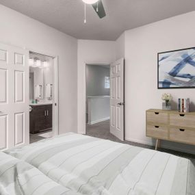 Townhome bedroom with ensuite bathroom carpet flooring and ceiling fan
