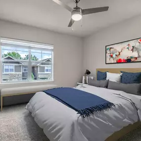 Townhome bedroom with ceiling fan and carpet flooring