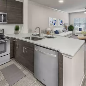 Townhome floor plan kitchen and living room with wood look flooring and ceiling fan