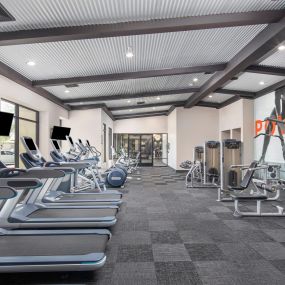 24-Hour fitness center with cardio and strength training machines