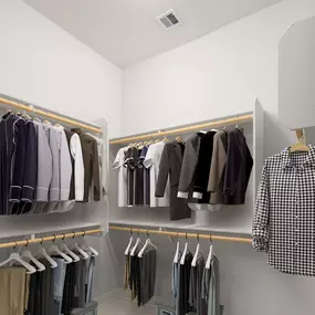 Walk in closet with wood shelving