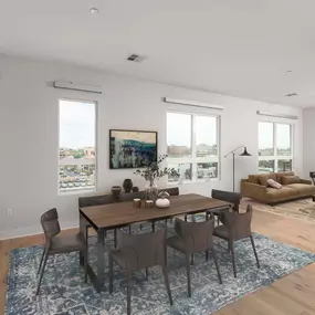 Penthouse open concept dining and living area with wood look flooring and track lighting