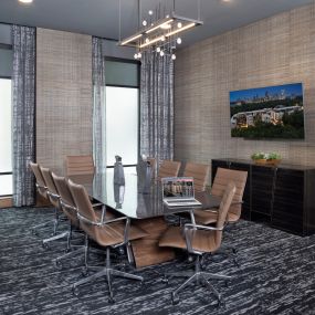 Conference room with table, chairs, and tv at Camden Buckhead in atlanta georgia