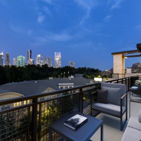 Penthouse apartment balcony with city skyline views