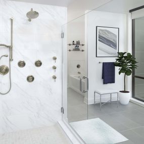 Spa-like walk-in shower and soaking tub in penthouse bathroom at Camden Buckhead in Atlanta GA
