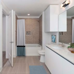 White contemporary bathroom with dual vanity, large mirror and bathtub and shower combination with geometric tile surround