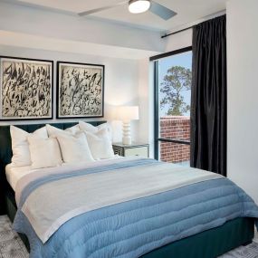 Modern gray bedroom with ceiling fan