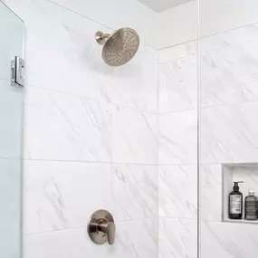 Modern gray bathroom stand-alone shower with tile surround