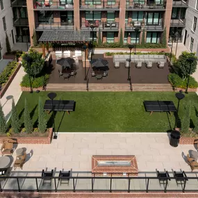 Courtyard with ping pong tables, BBQ grills, and outdoor dining areas