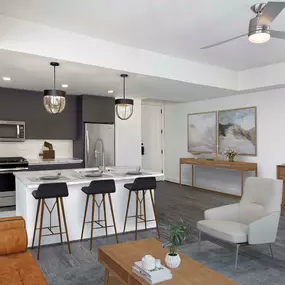 Modern gray living room and kitchen with hardwood-style flooring and tray ceiling with ceiling fan.