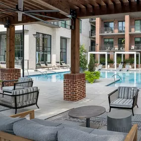 Poolside, covered cabanas with seating and ceiling fan