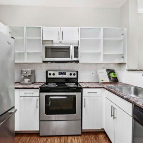 Kitchen with stainless steel appliances and electric range