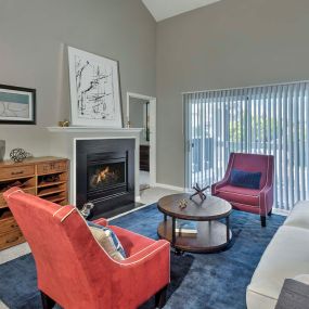 Living room with high ceilings and electric fireplace