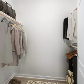 One bedroom spacious walk-in closet at Camden Fair Lakes Apartments in Fairfax, VA.