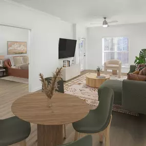 Open-concept living room with a ceiling fan and wood-style flooring all throughout at Camden Fair Lakes Apartments in Fairfax, VA.