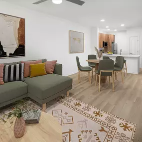 Open-concept living and dining space with a ceiling fan, wood-style flooring, and recessed lighting at Camden Fair Lakes Apartments in Fairfax, VA.