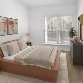 One bedroom with wood-style floors and a large window for sunlight at Camden Fair Lakes Apartments in Fairfax, VA.
