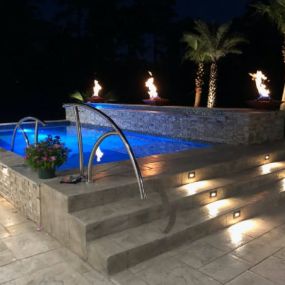 Custom Pool with Lighting and Fire Fountains