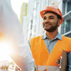 Client consultation on a commercial construction site demonstrating Schonsheck, Inc.’s commitment to communication, quality, and precision. Every project is built on trusted partnerships and a proven design-build process from planning through completion.