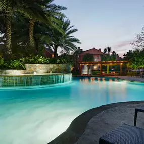 Resort style pool with tanning shelf wifi water features and grills at Camden Holly Springs Apartments in Houston, TX