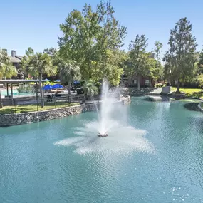 Private lake with water feature at Camden Holly Springs Apartments in Houston, Tx